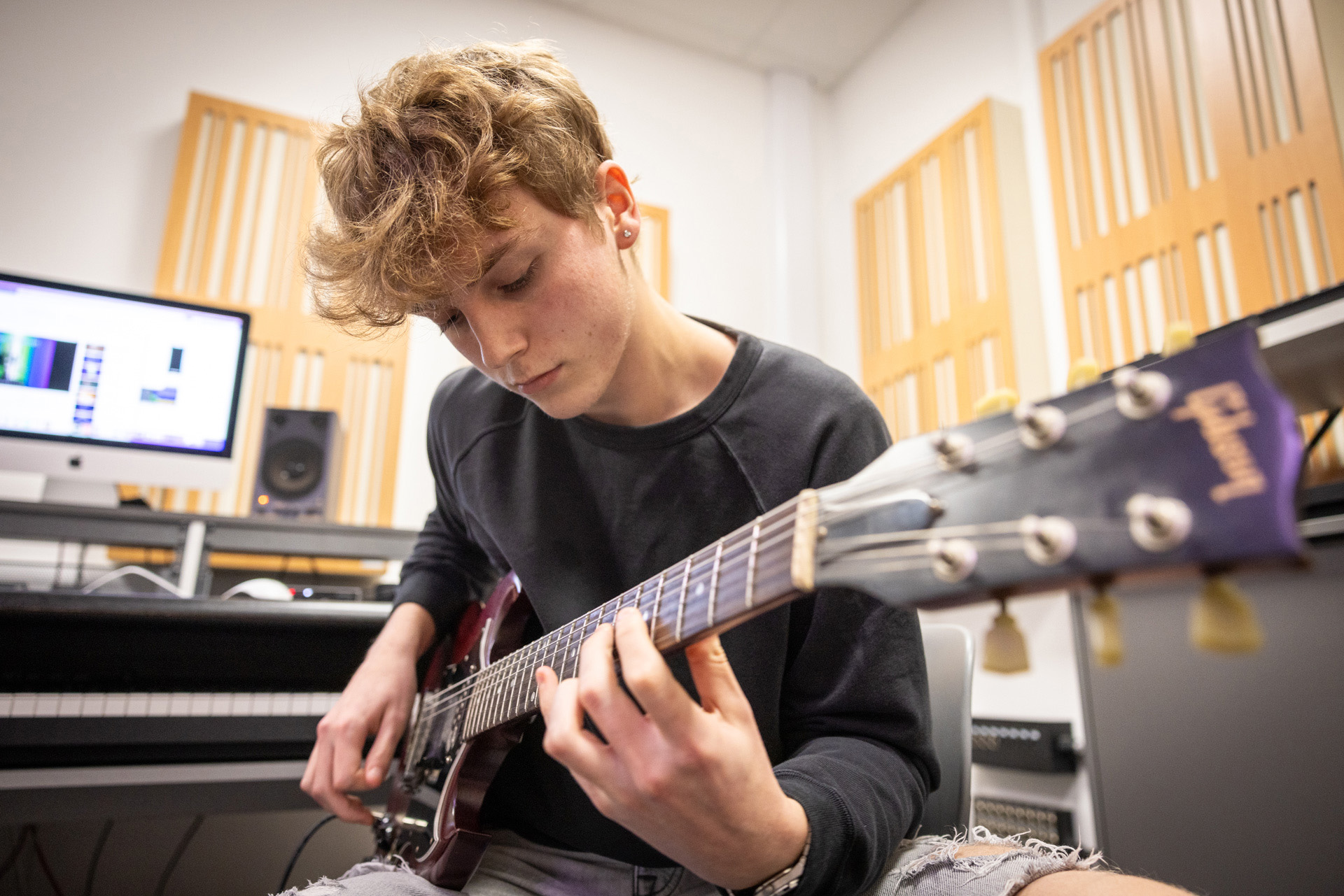 music student playing guitar