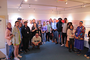 students and teachers posing at their art exhibition at the Museum of Richmond