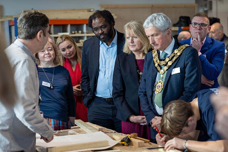 The Mayor of Richmond, Cllr Richard Pyne and Ayo Akende, Assistant Director of Skills and Employment - Delivery, GLA join other guests at the STEM Centre opening at RuTC and watch a carpentry demonstration.